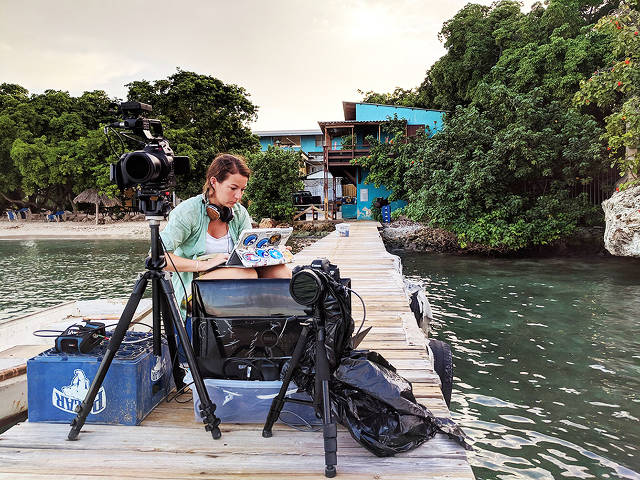 Videographer Ellie Mackay preparing on the Carmabi jetty, Encounter Edu